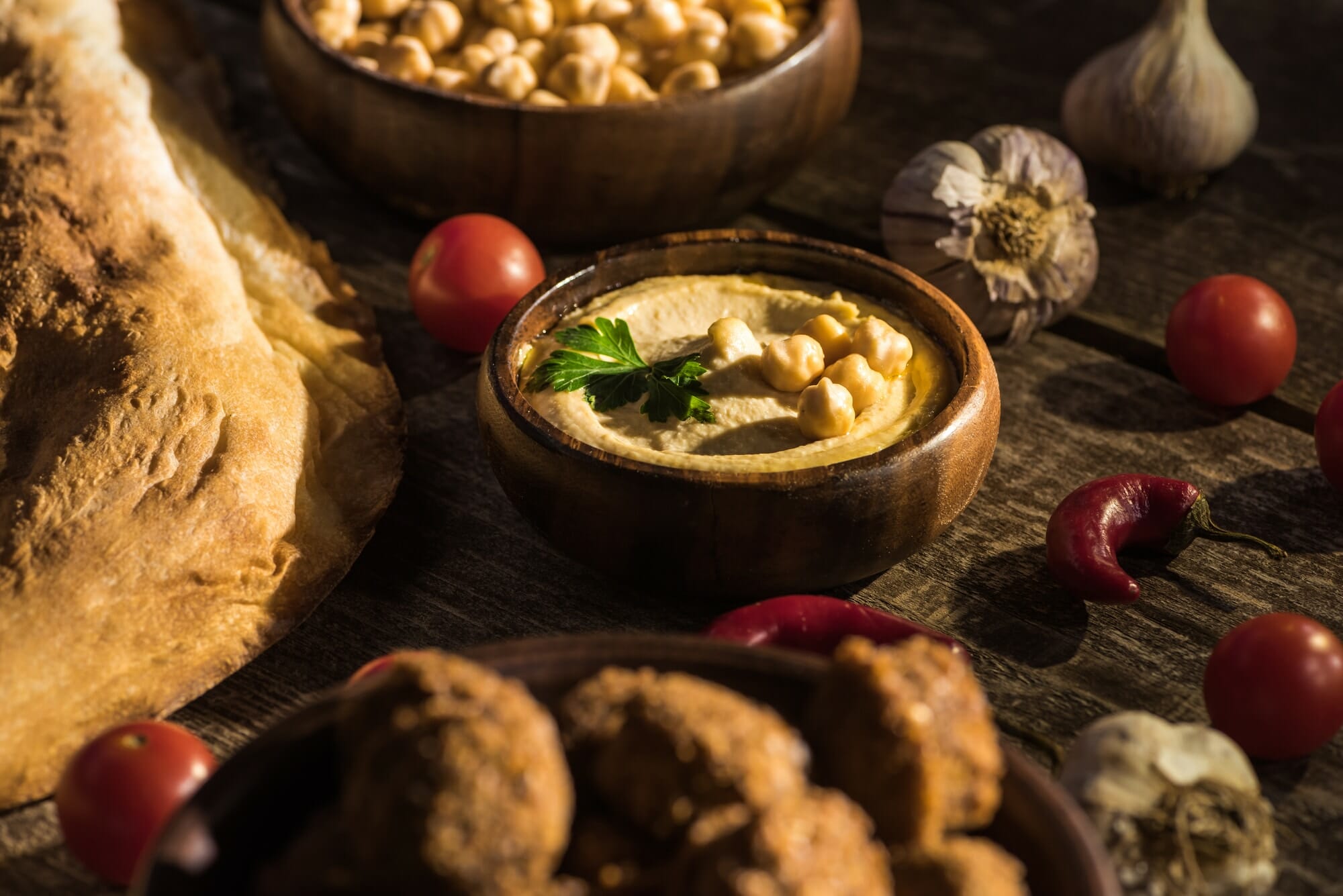 Falafel and delicious hummus, chickpeas, pita, vegetables and spices